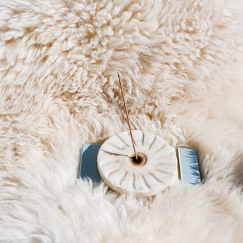 Incense Stick on Stone Base on Fluffy Fur Blanket